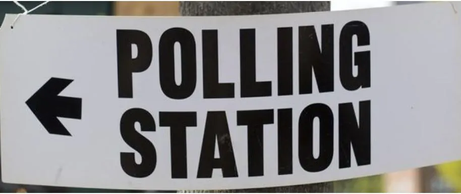 Polling station sign with arrow