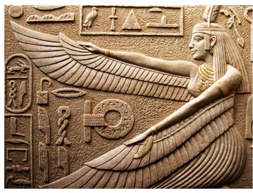 Egyptian stone carving showing a goddess with long hair and feather wings along her arms.  She is wearing a heavy necklace, bracelet and headband with a feather tucked into each.  She is surrounded by hieroglyphs (Egyptian writing in symbols) and various objects.