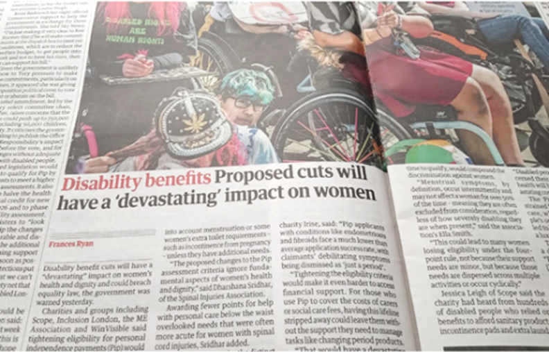 Guardian newspaper photo of wheelchair users protesting. Headline: Disability benefits -- Proposed cuts will have devastating effect on women
