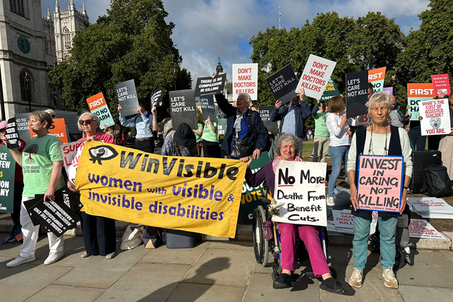 Part of a varied crowd of people opposing the assisted dying Bill. WinVisible women with our banner and placards including No More Deaths from Benefit Cuts, Invest in caring not killing (Global Women's Strike).